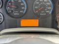 Dashboard of a 2011 International 4300 displaying RPM and speed gauges along with an odometer reading of 10554 KM