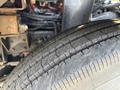 Close-up of a tire on a 2011 Autocar Xpeditor showing tread pattern and rubber surface details