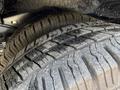 Close-up of the tread on a tire from a 2019 Ford Econoline showing wear patterns and grooves designed for traction