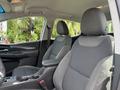 Interior view of a 2023 Chevrolet Bolt EV featuring gray fabric seats with a sleek design and a console in between the front seats
