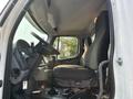 Interior view of a 2016 Freightliner M2 106 showing the driver's seat steering wheel and gear shift in the cabin