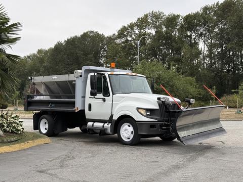 A 2012 International TerraStar truck with a snow plow attached at the front and a dump bed in the back