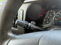 Close-up of the steering wheel and control stalk of a 2017 Chevrolet Express showing the speedometer and additional gauges