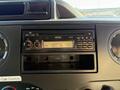 The image shows the dashboard of a 2016 Ford Econoline featuring a car radio and empty slot for additional equipment or storage