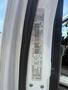 A label with vehicle information from a 2016 RAM 5500 mounted on the inside of the driver's door frame