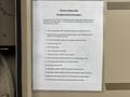 A printed instruction sheet titled "Portable Generator Procedures" with steps for operating a generator displayed on a surface