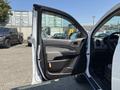A 2017 Chevrolet Colorado with the driver's side door open showcasing the interior features and door panel details