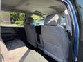 Interior of a 2017 Chevrolet Silverado 1500 showing the back seating area with two gray upholstered seats and a spacious cabin design