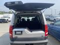 A 2006 Land Rover LR3 with the rear hatch open displaying the interior cargo space