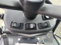 Close-up of the control panel of a 2019 Madvac LS175 featuring three buttons for hazard lights windshield wiper and washer functions
