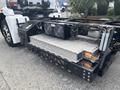 2020 Lion Lion6 featuring a large battery pack and cooling system mounted on the chassis with visible electrical components and connectors