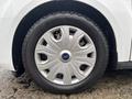 A close-up of a wheel and tire of a 2019 Ford Transit Connect featuring a silver alloy rim and black tire with visible tread pattern