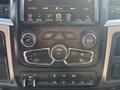 Interior dashboard controls of a 2014 RAM 5500 featuring buttons for climate control audio settings and navigation