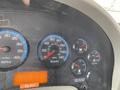 Dashboard of a 2014 International Durastar showing various gauges including speedometer fuel gauge and warning lights