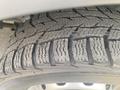 A close-up of a tire from a 2017 Ford Transit showing detailed tread patterns designed for traction on various surfaces