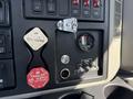 Control panel of a 2008 International 7500 featuring switches dials and labels for various functions and air supply controls