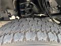 Close-up of a 2016 RAM 5500 tire showcasing the tread pattern and a portion of the suspension system underneath