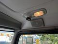 Interior view of a 2020 Peterbilt 330 featuring a ceiling light and a speaker mounted in the cab