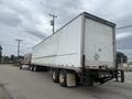 A 2010 Great Dane 45-foot trailer truck parked on a roadway with a truck cab attached to the front