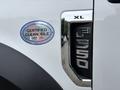 A 2018 Ford F-550 with a blue sticker labeled CERTIFIED CLEAN IDLE on the side of the vehicle