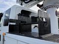 A black metal tool holder with multiple slots mounted on a flat surface of a 2013 International Durastar 4300 truck