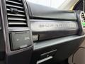 Close-up of the dashboard in a 2021 Ford F-350 Super Duty featuring air vents and controls with a textured surface and brand lettering