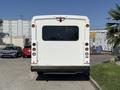 A white 2020 Chevrolet Express van viewed from the rear with minimal markings and taillights visible