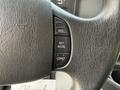 Close-up of the steering wheel of a 2011 Ford Econoline showing control buttons for cruise control including RES SET ACCEL and COAST