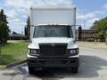 Front view of a 2014 International TerraStar box truck with a white cab and a large cargo area on the back