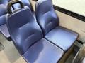 Two blue vinyl seats designed for a 2020 Chevrolet Express with textured surfaces and contoured backs sitting side by side
