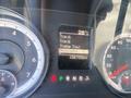 The dashboard display of a 2015 RAM 2500 showing various trip metrics and a trailer tow indicator with a temperature reading of 28 degrees Celsius and a total mileage of 138755 kilometers