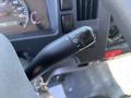 The image shows the turn signal lever of a 2016 Isuzu NPR-HD with various symbol controls for lights and signaling