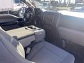 Interior of a 2017 Ford F-150 showing front seats and dashboard with controls and a central console