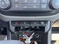 Interior dashboard controls of a 2017 Chevrolet Colorado featuring air conditioning buttons and various switches for vehicle functions