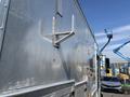 A silver 2008 Workhorse W62 truck with a metallic finish and a mounted bracket on the side