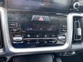 Dashboard control panel of a 2022 Kia Sorento featuring climate control buttons and a digital display