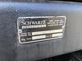 A metal identification plate displaying details about a 2012 International DuraStar 4300 including the serial number model number and manufacturing date