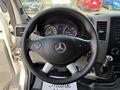 Interior view of a 2017 Mercedes-Benz Sprinter showing the steering wheel dashboard and control panel