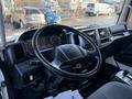 Interior view of a 2015 Hino 358 truck featuring a steering wheel dashboard and control panel