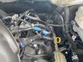 A close-up view of the engine compartment of a 2019 Ford Transit showcasing various interconnected hoses and wires