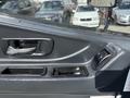 Interior door handle and window controls of a 2012 Autocar Xpert vehicle