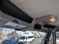 Interior view of a 2013 International 7500 showing the ceiling area with a light and mesh storage net