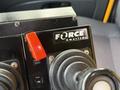 Control panel featuring a red toggle switch and two black joystick controls labeled with the Force America logo