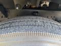 Close-up of a tire from a 2004 Ford F-750 showcasing its tread pattern and texture