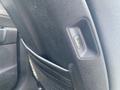 A close-up of the back of a seat in a 2022 Kia Sorento showing a USB port and a pocket for storage