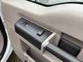 The image shows the interior door handle and window controls of a 2008 Ford F-350