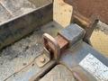 Close-up of the rusted locking mechanism on a 2013 JLG Industries 1014 lift showing a metal latch and mounting area