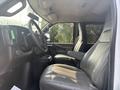 2021 Chevrolet Express interior showing front seats dashboard and steering wheel with ergonomic design and upholstery