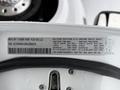 A 2024 RAM 5500 truck with details and specifications visible on a label attached to its interior