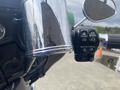 Close-up of the handlebar controls of a 2017 Harley-Davidson FLHTKL featuring a chrome finish and switches for lights and other functions